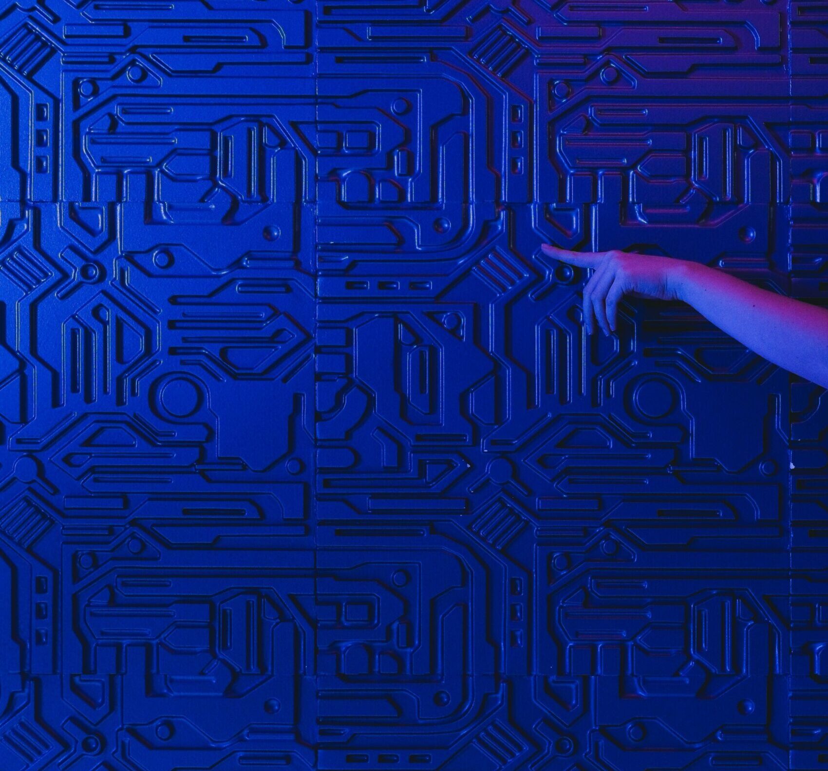 Abstract human silhouette dissolving into geometric data structures and flowing signal lines representing operational integration.