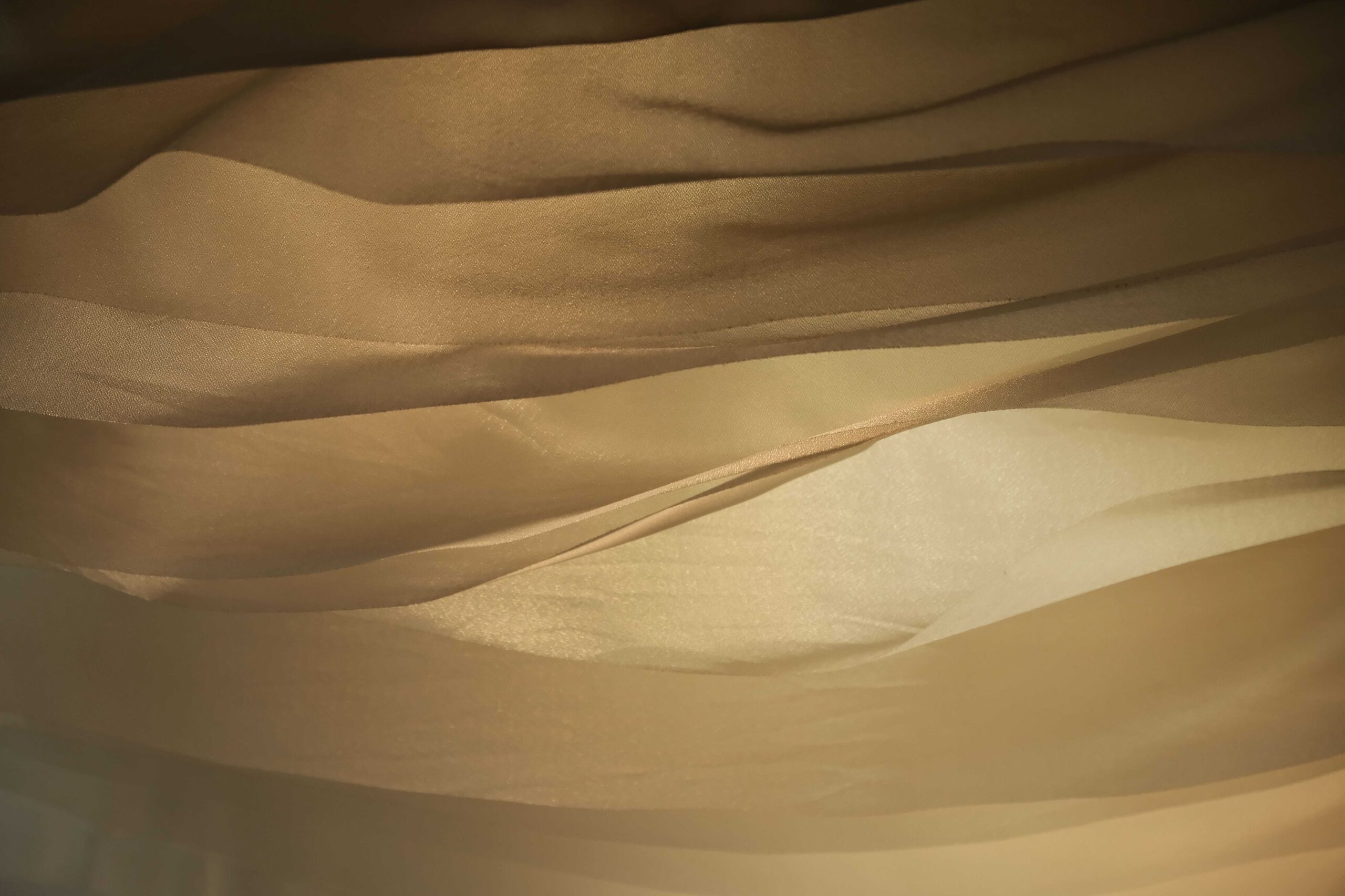 Gentle waves flowing across a smooth silk surface.
