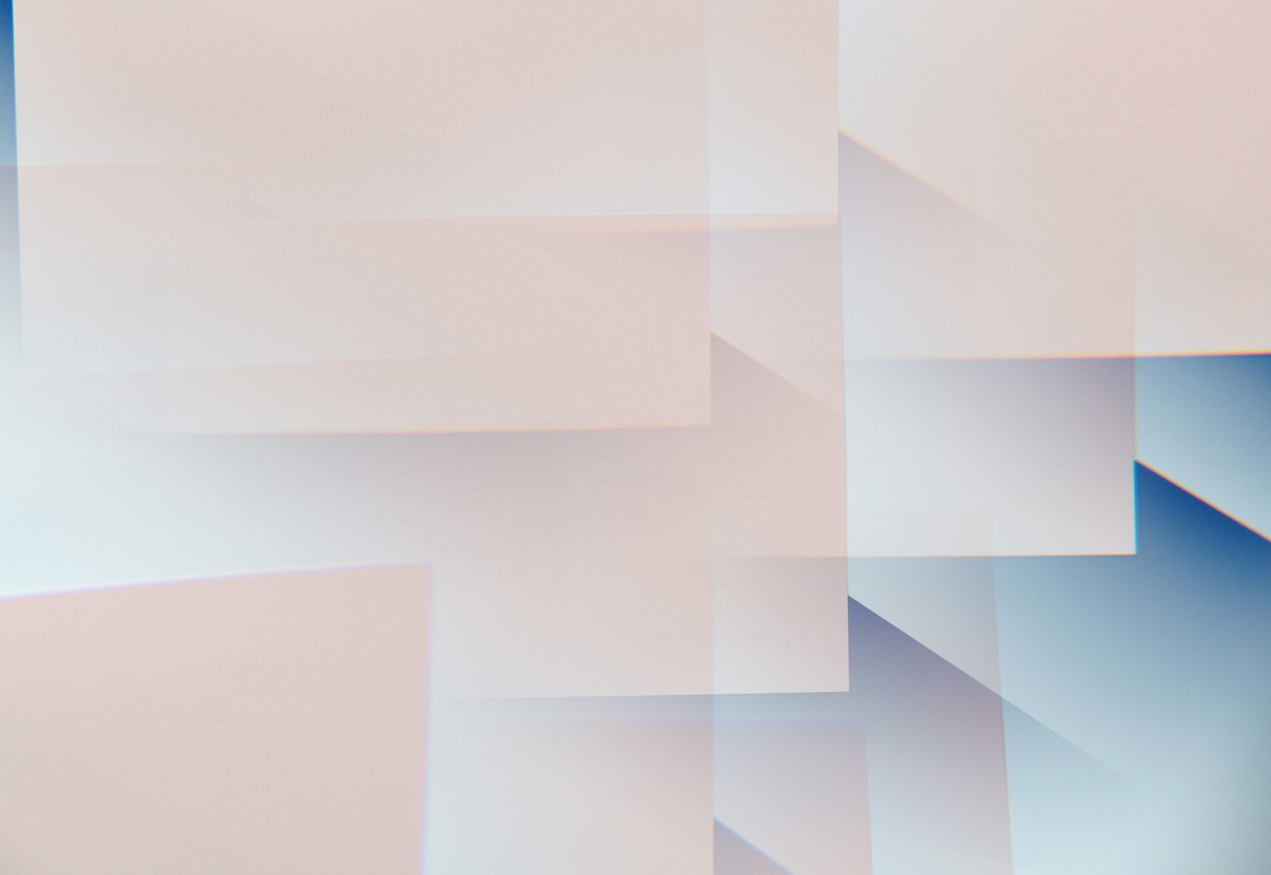 Overlapping abstract squares blending into one another in neutral tones.