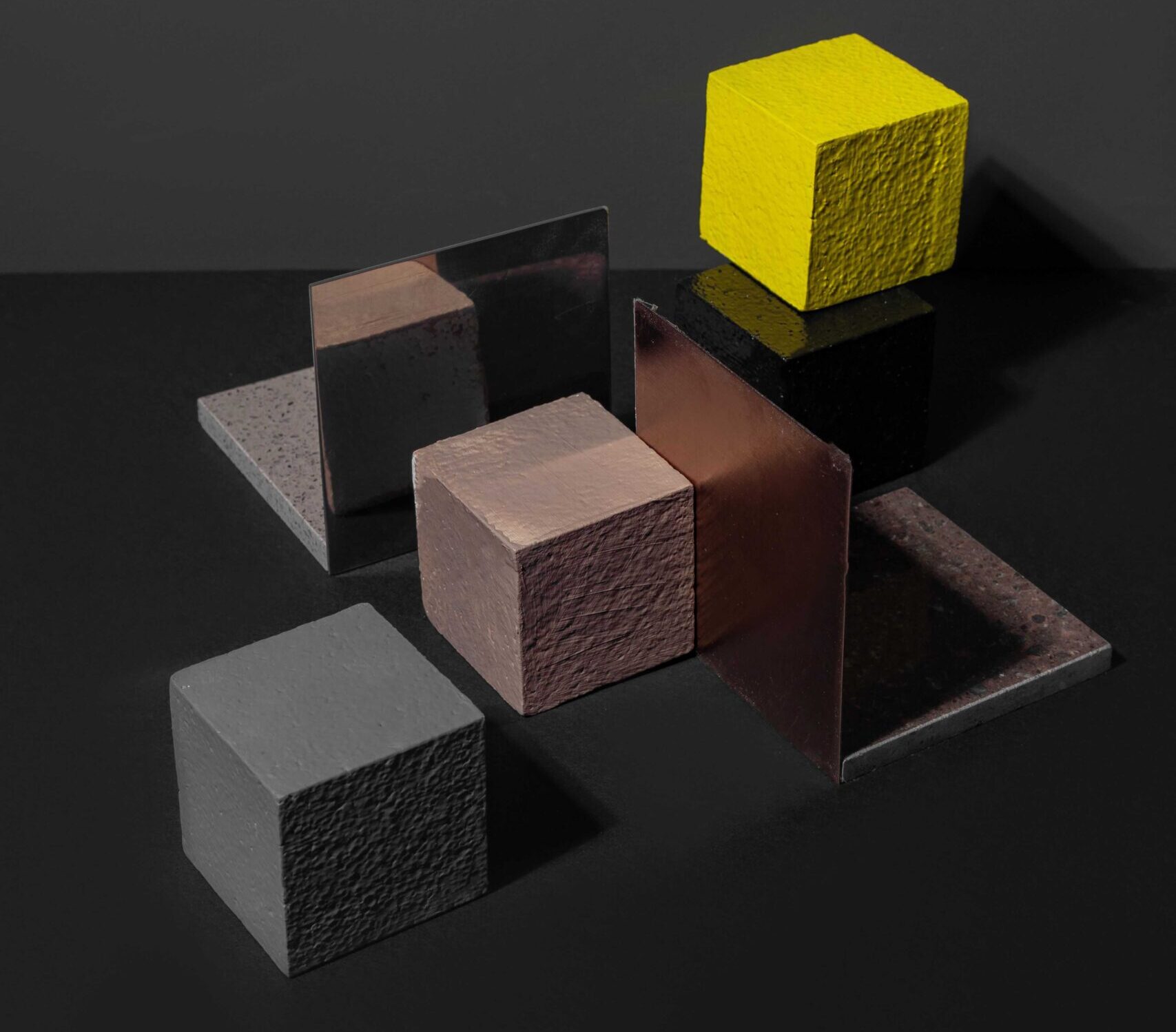 Multiple squares with one elevated yellow square standing apart.